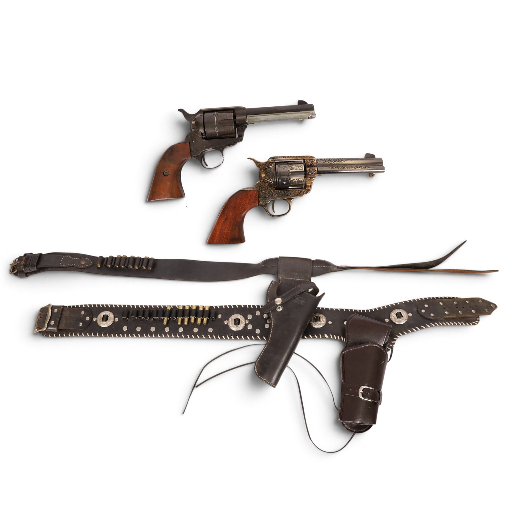 Two replica colts, each with a leather holster 