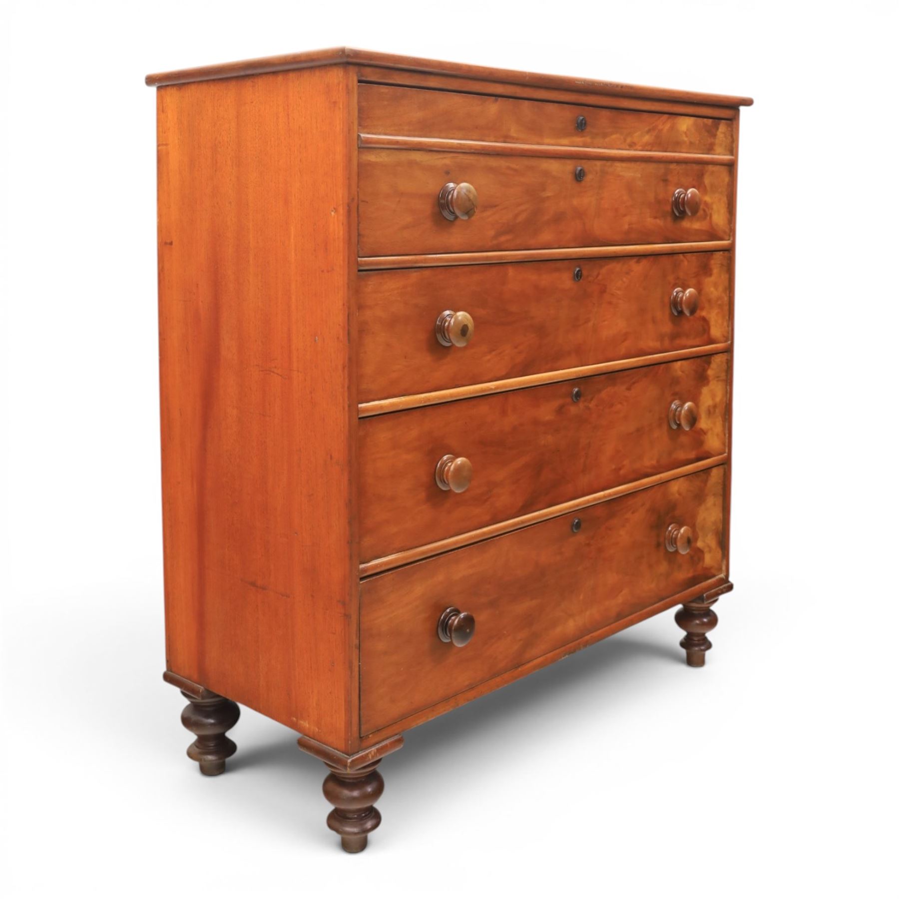 Victorian mahogany chest, with four long  flame mahogany fronted drawers with turned wooden knobs, raised on turned bun feet 