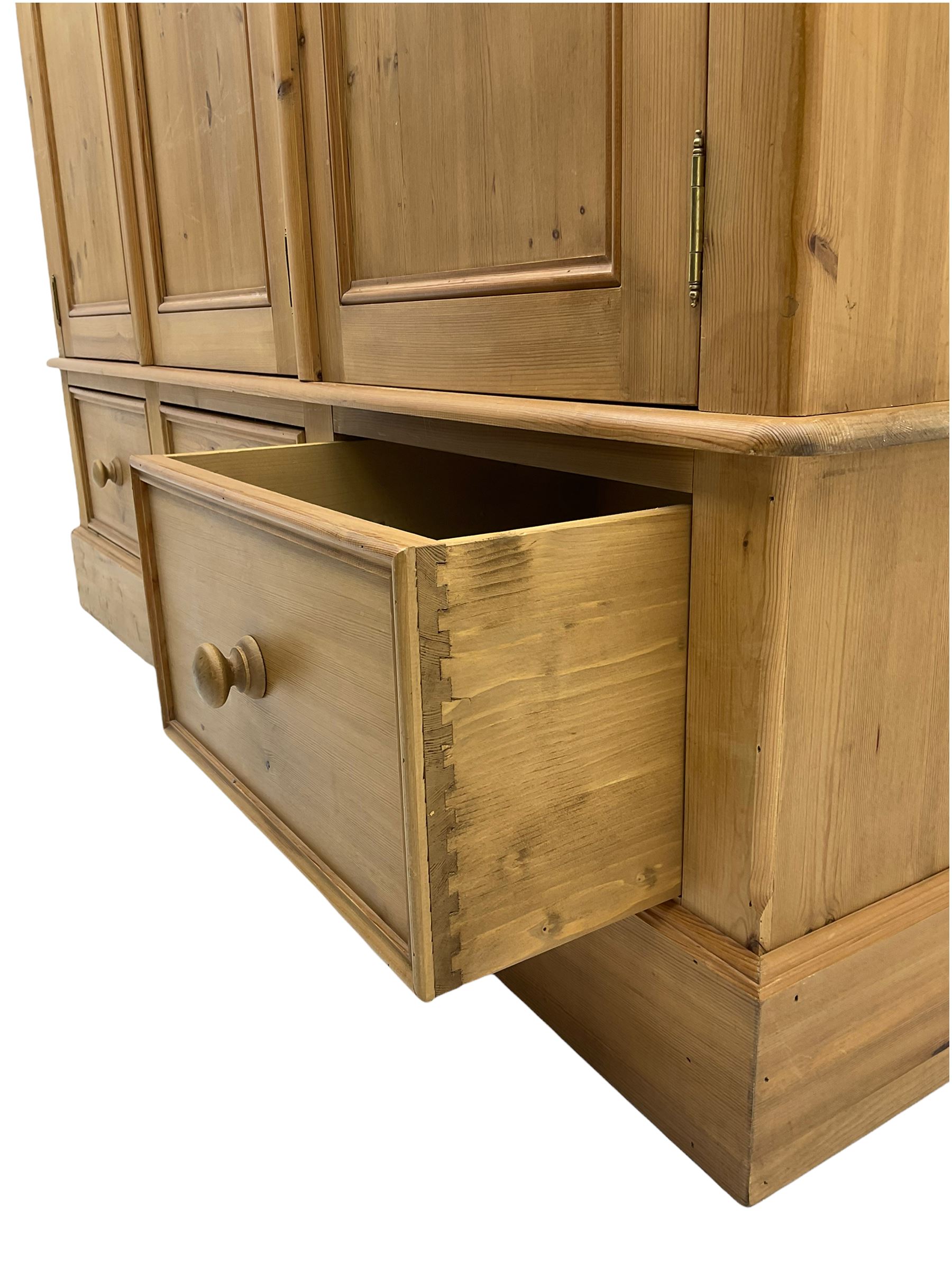 Solid pine triple wardrobe with three drawers
