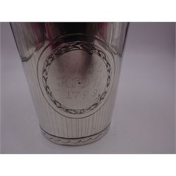 Late 18th century/early 19th century European silver beaker, of tapering cylindrical form, the body engraved with floral sprig to one side and personal engraving dated 1798 to the other, with three marks beneath, H10.5cm