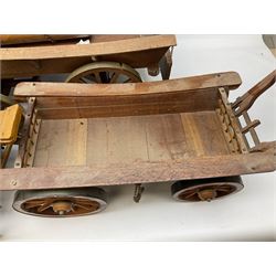 Four Melba Ware Shire horse figures and another similar, and three wood carts