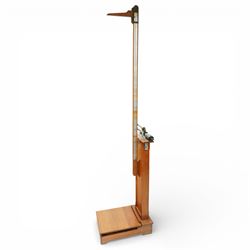 Early 20th century French oak height and balance scales, with graduated vertical rule, adj...