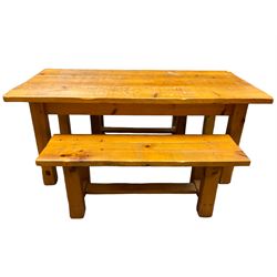 Pine dining table, rectangular plank top on square supports (181cm x 91cm, H80cm); together with two benches (133cmx 41cm, H47cm)