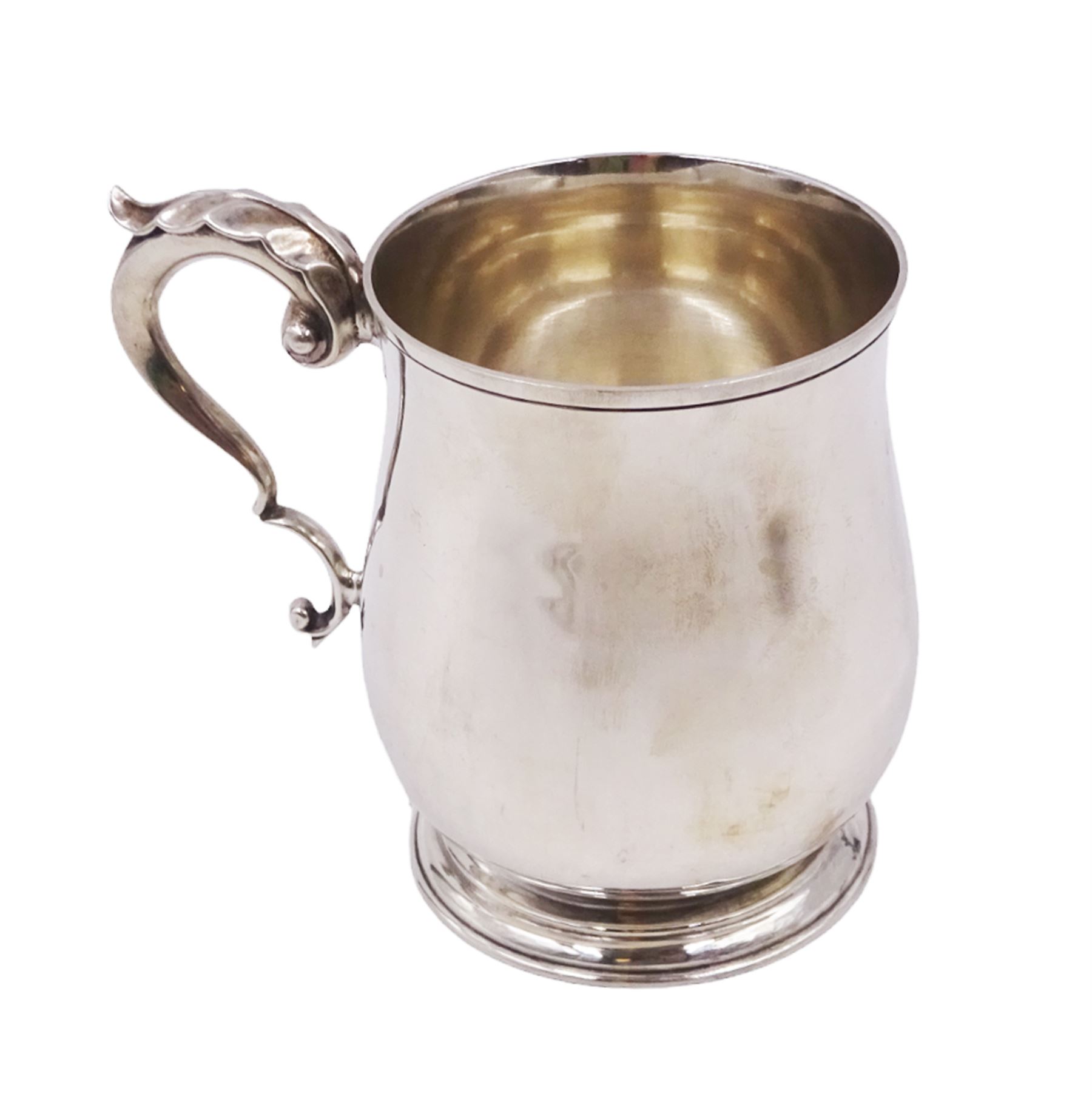 1920s silver christening mug, of plain waisted form with acanthus capped C scroll handle, upon circular stepped foot, hallmarked J B Chatterley & Sons Ltd, Birmingham 1920, H9.5cm