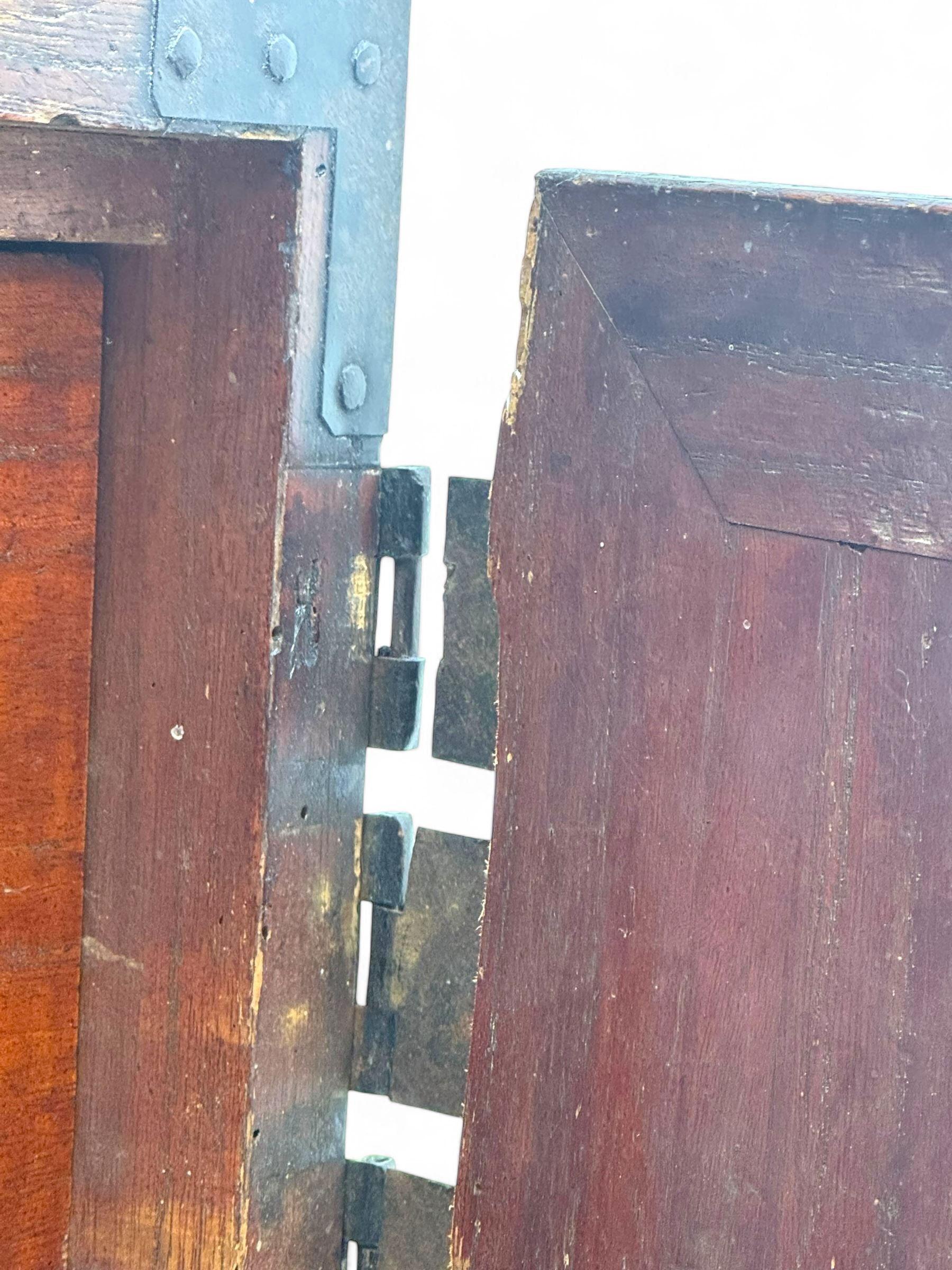Late 19th century Japanese tansu chest, crafted with a cedar frame and cypress wood panels, original iron fittings throughout, comprising a single long drawer above smaller drawer and hinged cupboard door enclosing two smaller internal drawers and storage compartment, mounted on a bespoke black metal stand