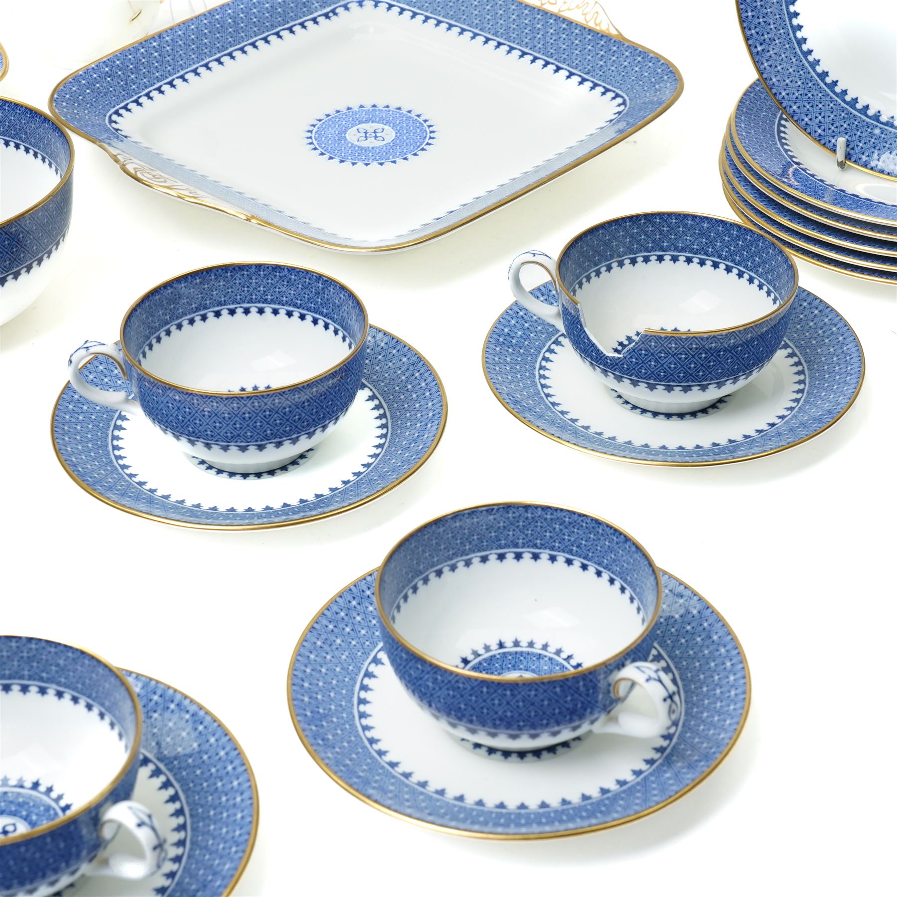 Wedgwood Lynn pattern blue and white tea service comprising eleven cups and saucers, twelve plates, milk jug, sugar bowl and two bread and butter plates