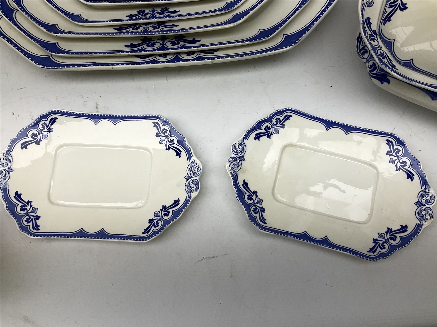 Burgess and Leigh Middleport pottery dinner wares decorated in the ‘Milford’ pattern, to include lidded tureens, graduated meat plates, dinner plates etc 