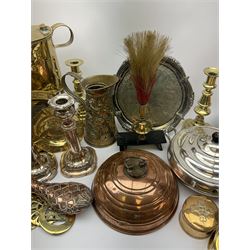 Group of metalware, to include pair of brass candlesticks, brass trivet, copper and brass powder flask, quantity of horse brasses, pair of silver plated telescopic candlesticks, silver plated salver, etc. 