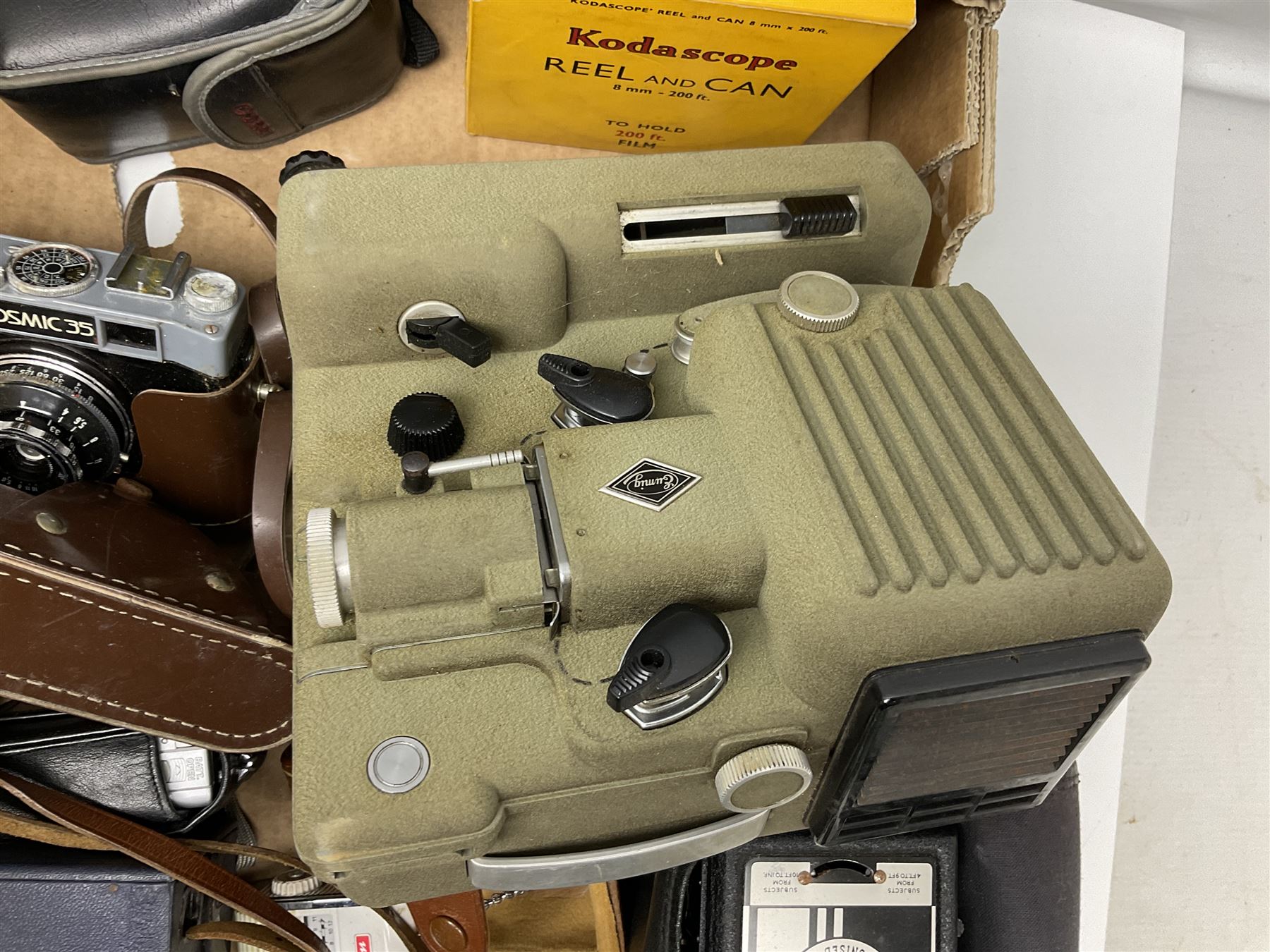 Collection of camera and equipment, to include Canon PowerShot S500, Cosmic 35, polaroid 320, etc, in two boxes  