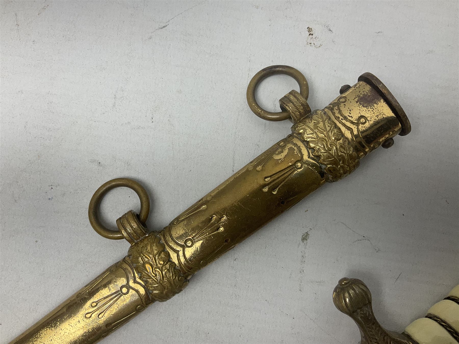 WW2 German kreigsmarine style dagger composed from various age parts, the post-war 25cm double fullered blade  with etched decoration and inscribed WKC with knight's head; in gilt brass scabbard with two rings L42cm overall