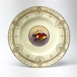 A Royal Worcester cabinet plate, with central hand painted fruit panel to centre depicting cherries and peaches, signed Townsend, upon a pale yellow ground with gilt foliate border to rim, with printed puce mark beneath, D26.5cm.