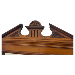 Victorian walnut bedroom suite - wardrobe, dressing chest and bedside cupboard, comprising a full-length wardrobe with broken pediment and central mirrored door, large lower drawer, a matching dressing table with bevelled swing mirror over two trinket drawers and two short drawers over two long drawers, and a single-door bedside cupboard, all with moulded edges, decorative panel work and shaped aprons