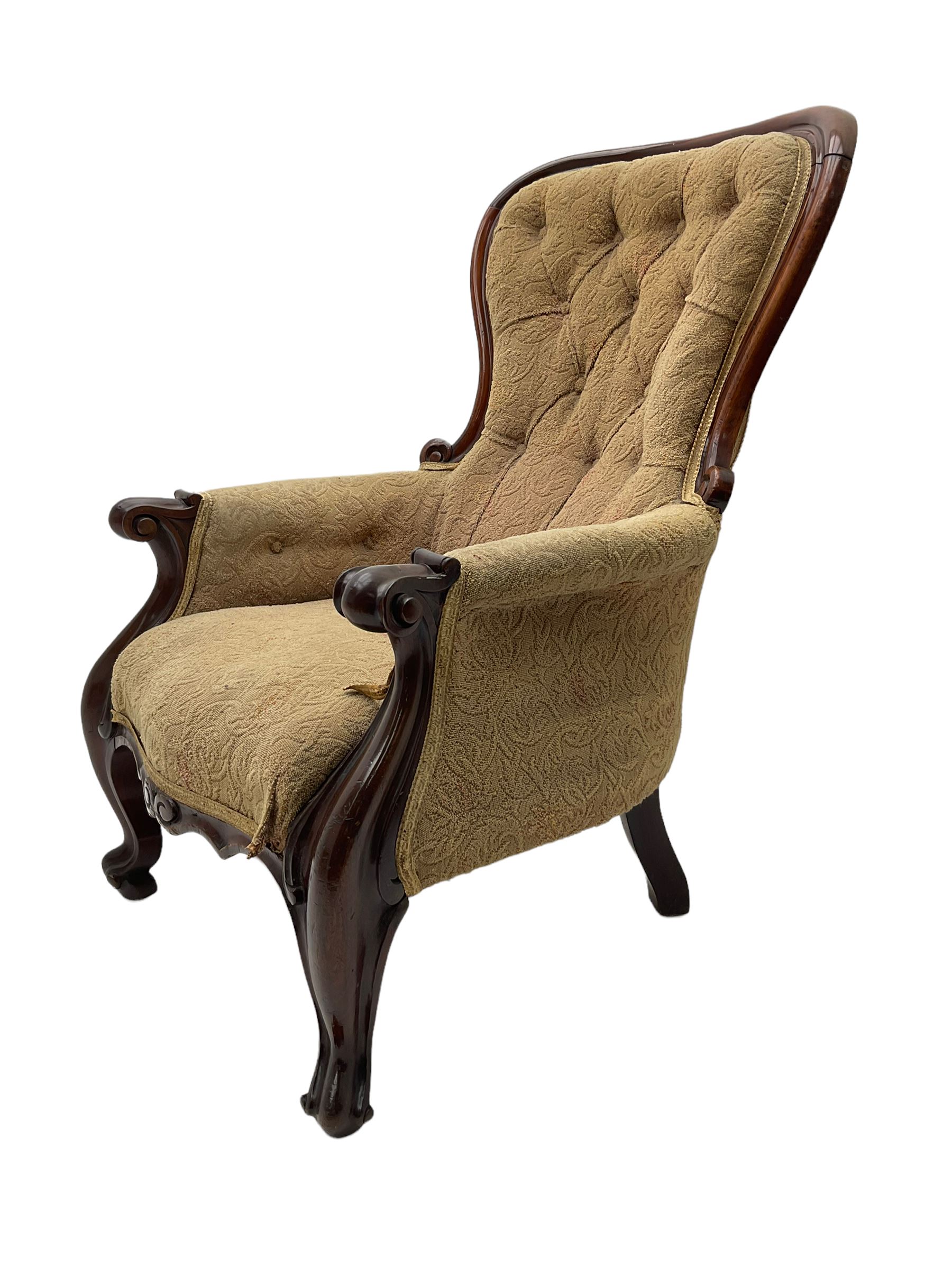 Victorian mahogany upholstered armchair, moulded framed, scroll carved arm terminals on scrolled cabriole supports, shaped carved apron