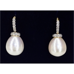  Pair of gold diamond and pearl drop ear-rings tested 18ct diamonds approx 0.4 carat  