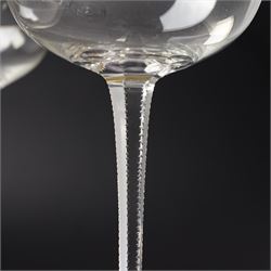 Set of six Wiener Werkstatte champagne coupe glasses, with gilt trimmed rim and foot, the faceted trumpet stem with toothed edges, H17cm 