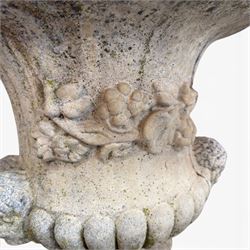 Pair of large cast stone garden urns, circular form with egg and dart border, tapering gadrooned bowl with cast handles and detail