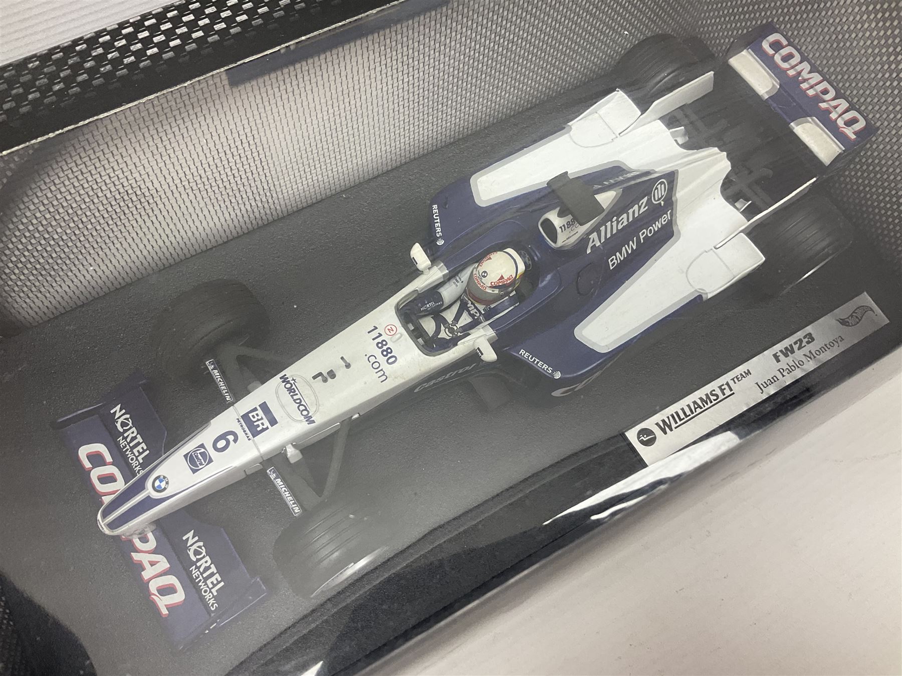 Five Mattel Hot Wheels 1:18 scale die-cast racing cars - Ferrari F1-2000 Michael Schumacher; Ferrari F-2002 Michael Schumacher; Jordan E-110 Heinz-Harald Frentzen; Williams F1 Team FW23Juan Pablo Montoya; and Ferrari F2001 Rubens Barrichello; all boxed (5)