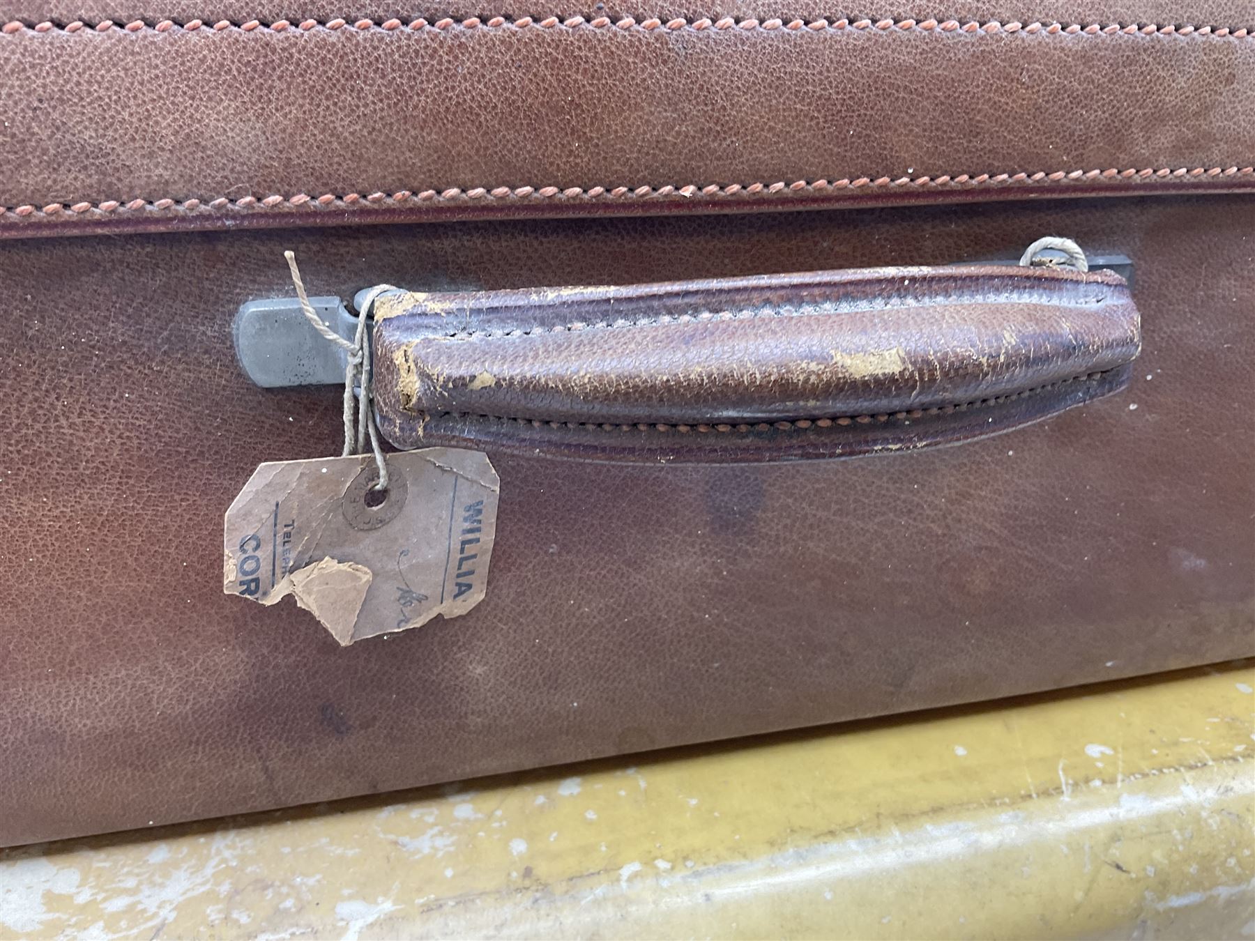 Vintage leather traveling case with monogram to cover, with watered silk lining to interior, and some contents, plus a further vintage travel case, (2)