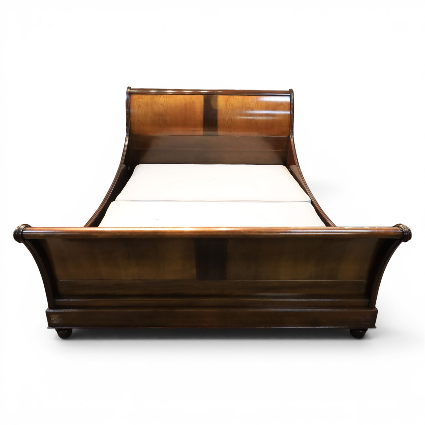 And So To Bed - 5' king size 'Palais' cherry wood sleigh bed, the cylindrical rolled head and foot rails over panelled boards with darker crossbanded detail, shaped scroll ends and moulded plinth base, with Vi-Spring divan base