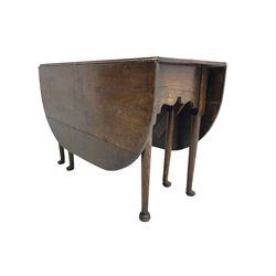 George III oak drop-leaf dining table, oval top over gate-leg action cabriole supports