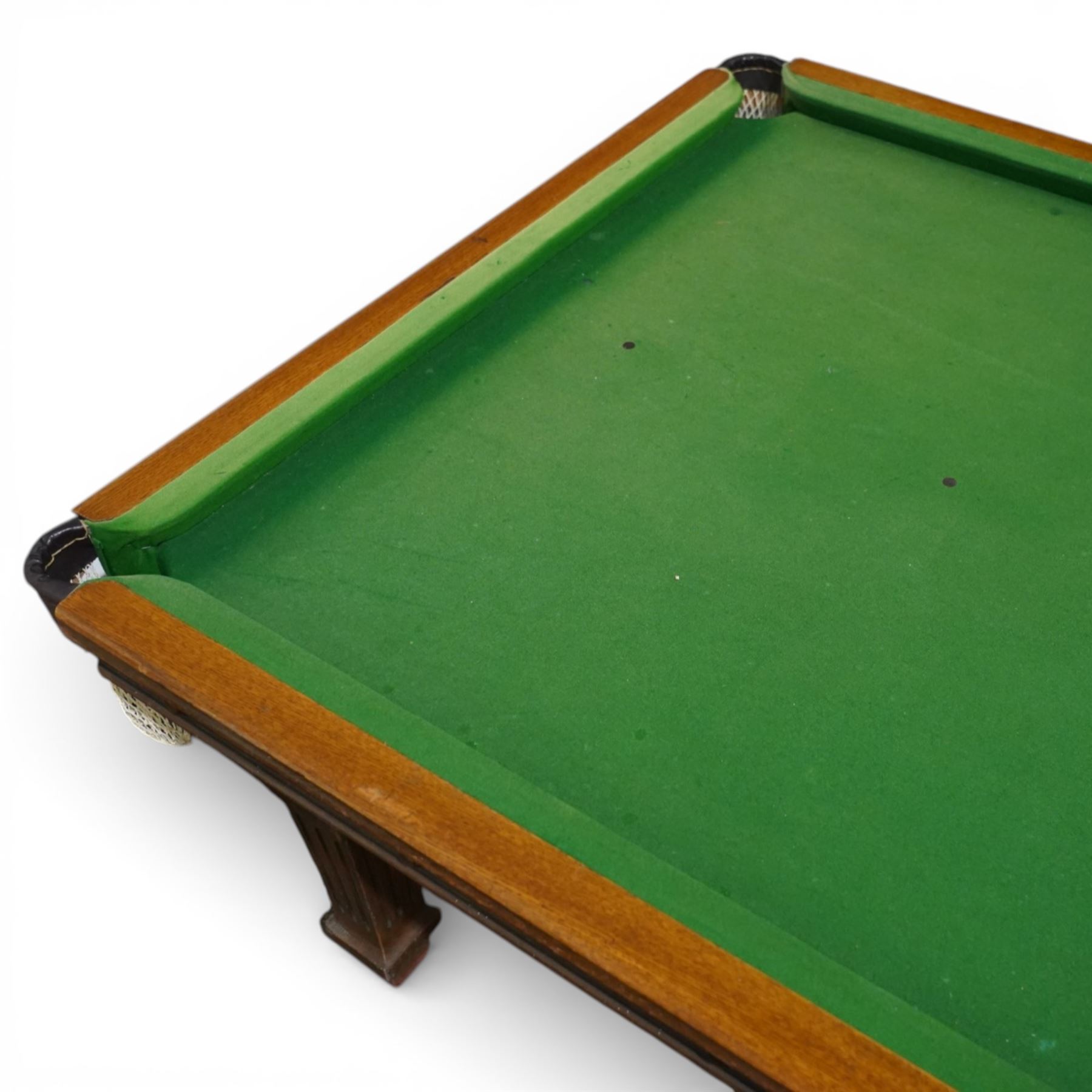 Riley - late 20th century Riley slate bed snooker table with dining table leaves, rectangular baize playing surface within a moulded hardwood frame with studded frieze rails and leather pocket mounts with net bags, raised on four square tapering fluted supports with block feet, with associated dining table leaves, with various cues, chalks, snooker and eight ball pools