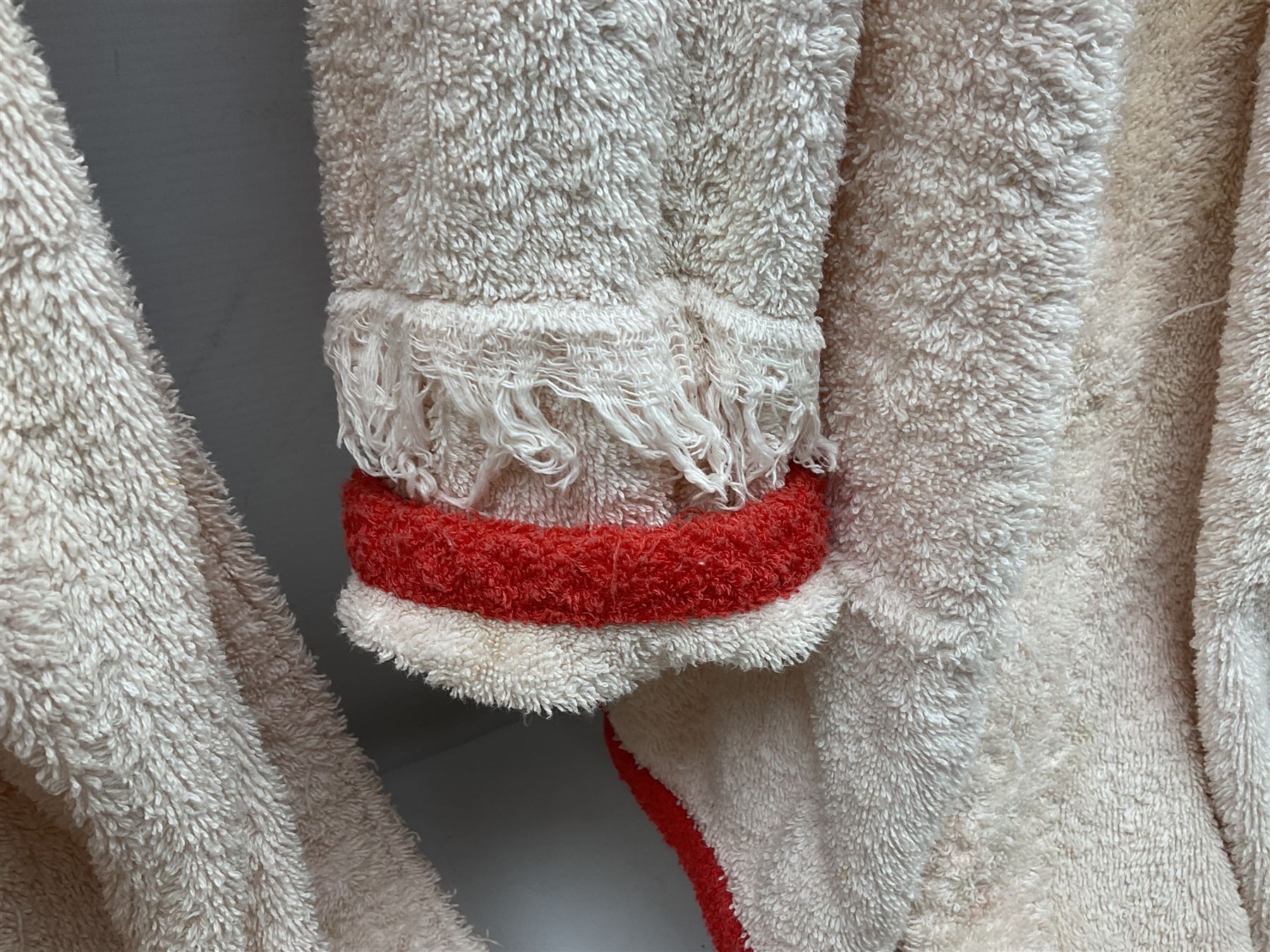 On the direct instructions of Anita Porter nee Lonsbrough Great British Olympic and Commonwealth Games gold medal winning swimmer - collection of early and international memorabilia comprising original Huddersfield Bath Club track suit top bearing eight stitched on cloth badges including British Empire & Commonwealth Games 1958 England Team, YSASA, North Eastern Counties ASA, ESSA Division 3,  English Schools Swimming Association winner etc
The swimming costume Anita wore at the 1958 Commonwealth Games in Cardiff, her first major championships, where she won two gold medals. The grey elastic on the sides, in those days, she would use to make it tighter and more streamlined.
Blue track suit from the 1960 Olympics which she wore on the podium receiving the gold medal.
1960 pool side towelling robe used at the Rome Olympics (interesting to note her name is spelt wrong on the embroidered label).
1962 Commonwealth Games pool side towelling robe used in Perth Australia when winning three Gold medals. 
It was also this year she became BBC Sports Personality of the year, the first female to do so.
Her 'lucky' pool side towel which she took with her to every event she competed in and which can be seen round her neck in many official celebratory photographs. Copies of some of these photographs are included for identification.
In addition there are two souvenir programmes of an evening event to honour Anita at The Theatre Royal Huddersfield and she has kindly signed the front cover on one of these.