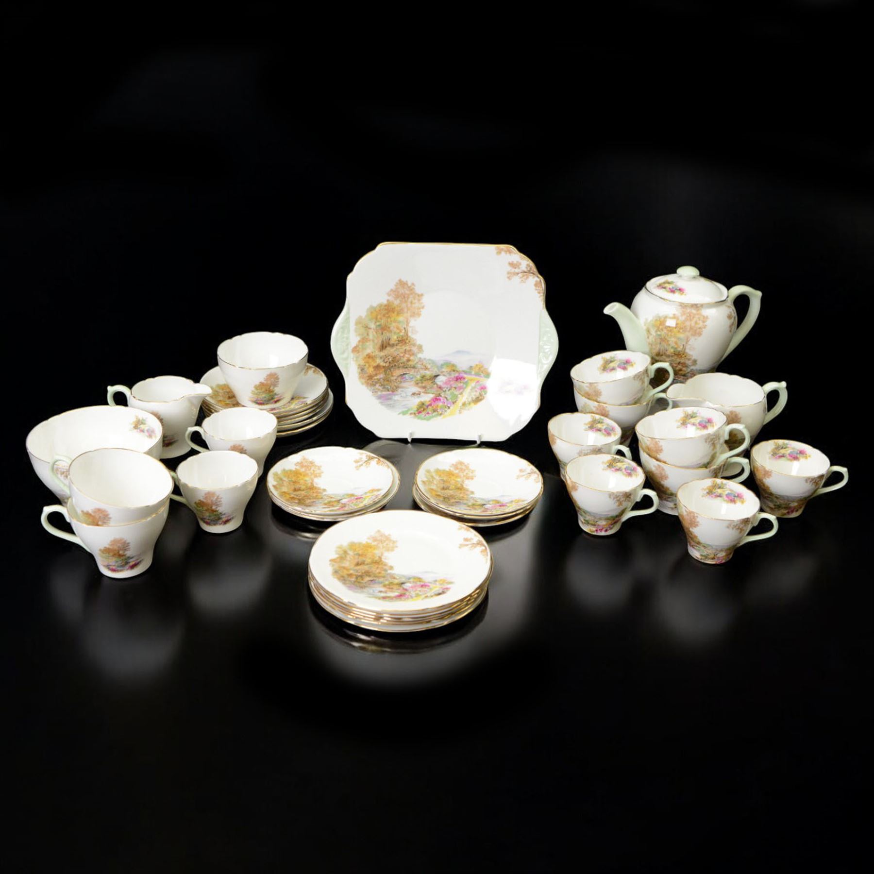 Shelley Heather pattern coffee service for six, including coffee pot, milk jug, two open sucrier, coffee cups and saucers, tea cups and saucers, etc