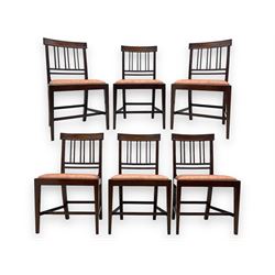 Early 20th century Regency design mahogany tilt-top table, circular top with edge banding, supported by a central turned pedestal with four reeded sabre supports terminating in castors; six chairs with pink upholstered drop in seats (7)