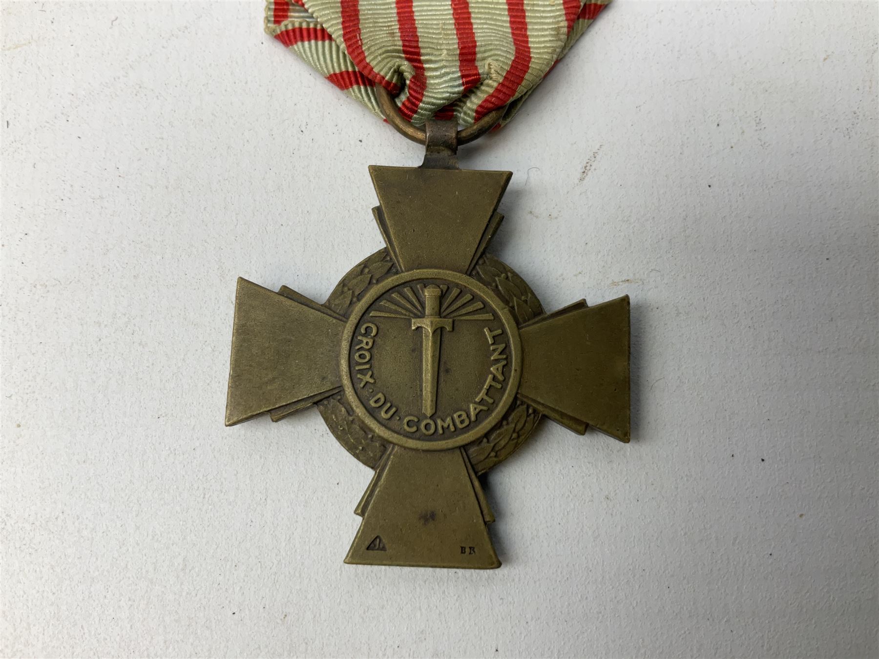 Five continental medals - WW1 Belgian Cross of Fire; WW1 French Croix De Guerre; French Croix De Combattant; French Republic Workers silver merit awarded to L. Mounet 1950; and boxed French Palmes Universitaires Officier d'Academie silver and enamel wreath (5)