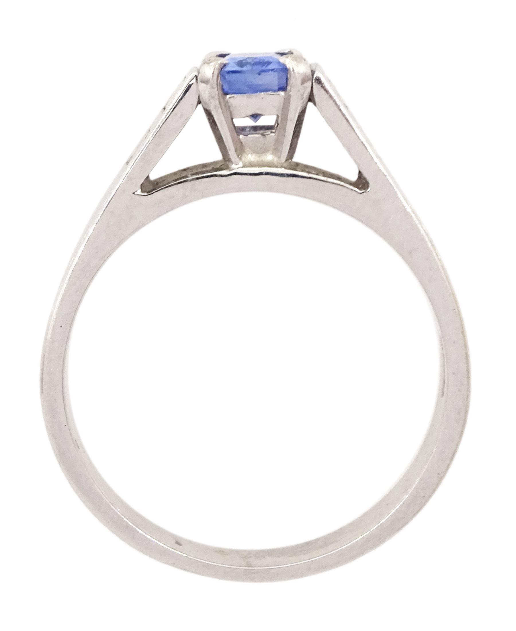 White gold sapphire and diamond ring, single stone radiant cut sapphire of approx 0.65 carat, with two baguette cut diamonds set either side, hallmarked 9ct