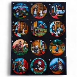 Set of twelve Mother Hubbard slides, H8cm