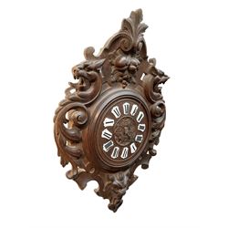 French- late 19th century carved oak wall clock c 1880, outer case with interlaced scroll carving and a carved images of fruit and wild beasts, integrated dial with porcelain cartouche Roman numerals and gothic hands, with a twin train spring driven rack striking movement striking the hours on a coiled gong.
