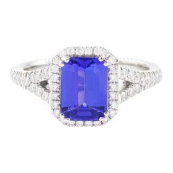 Platinum tanzanite and diamond cluster ring, single emerald cut tanzanite of approx 1.75 c...