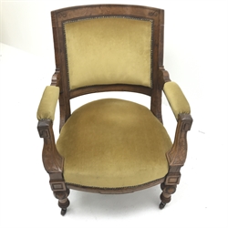 Late Victorian armchair upholstered in yellow fabric, shaped cresting rail, carved cup and cover supports, W71cm