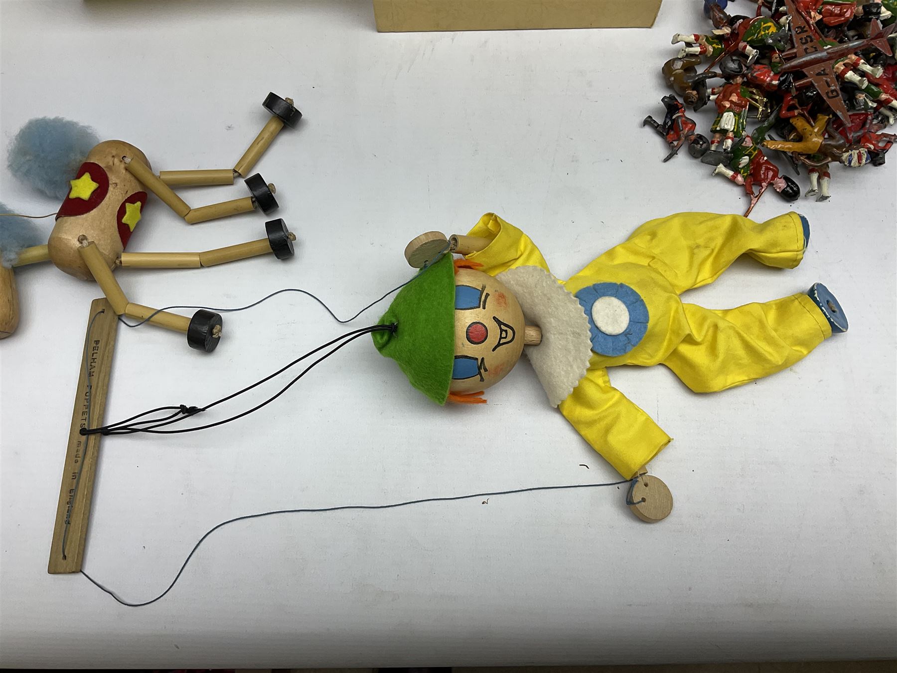 Vintage toys comprising 'Docking RMS Queen Mary' game, two boxed Pelham puppets, quantity of painted metal British soldiers to include Guardsmen, painted farm animal figures