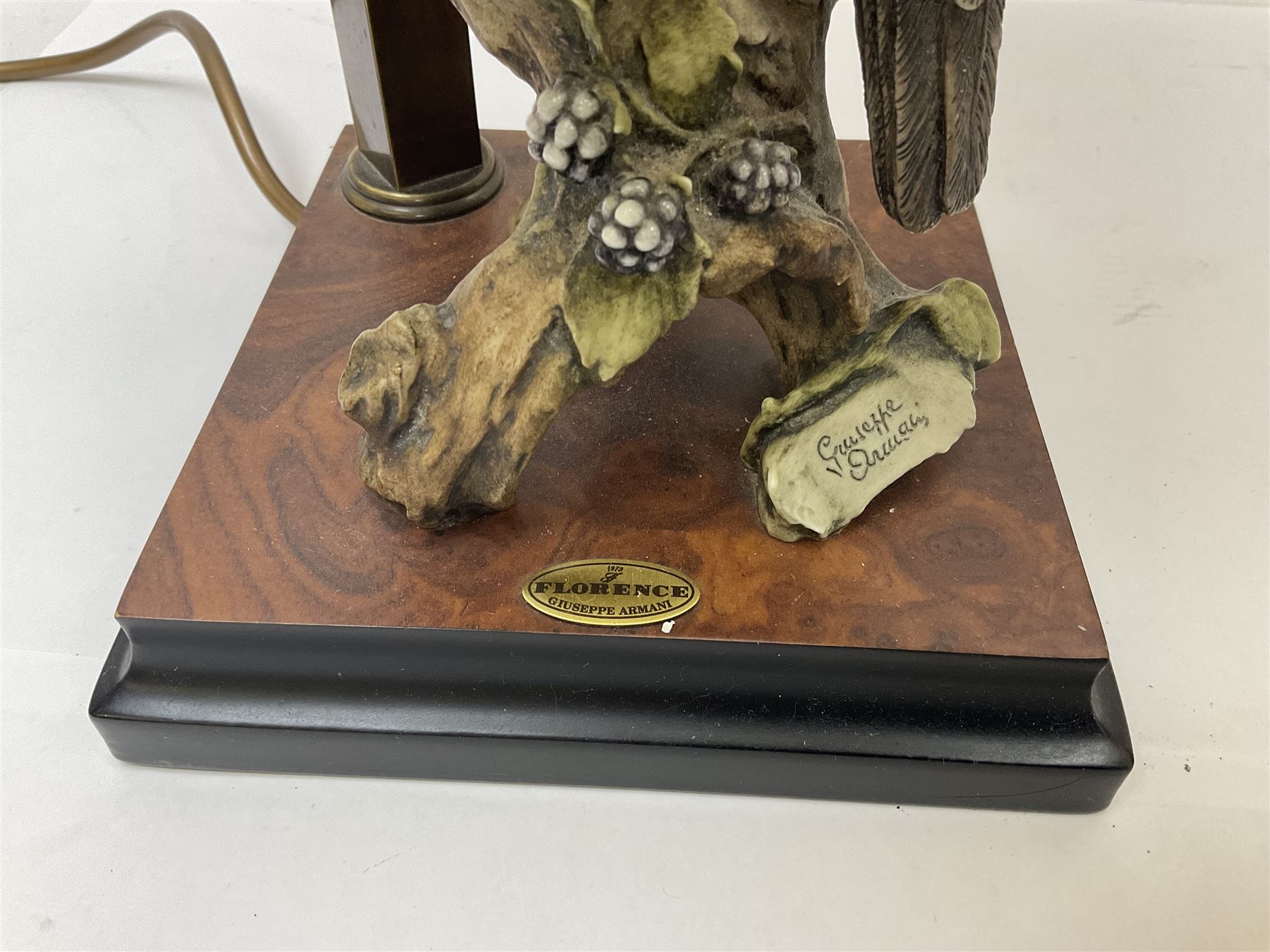 Two Giuseppe Armani figural lamps, the first modelled as an owl perched upon a book, the second modelled as a pair of owls perched upon blackberry branch, each with damask fabric tassel shades, tallest H76cm