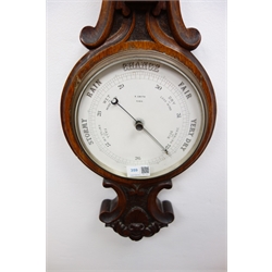  Edwardian carved oak aneroid barometer with thermometer, circular dial signed R.Smith, York, H83cm  