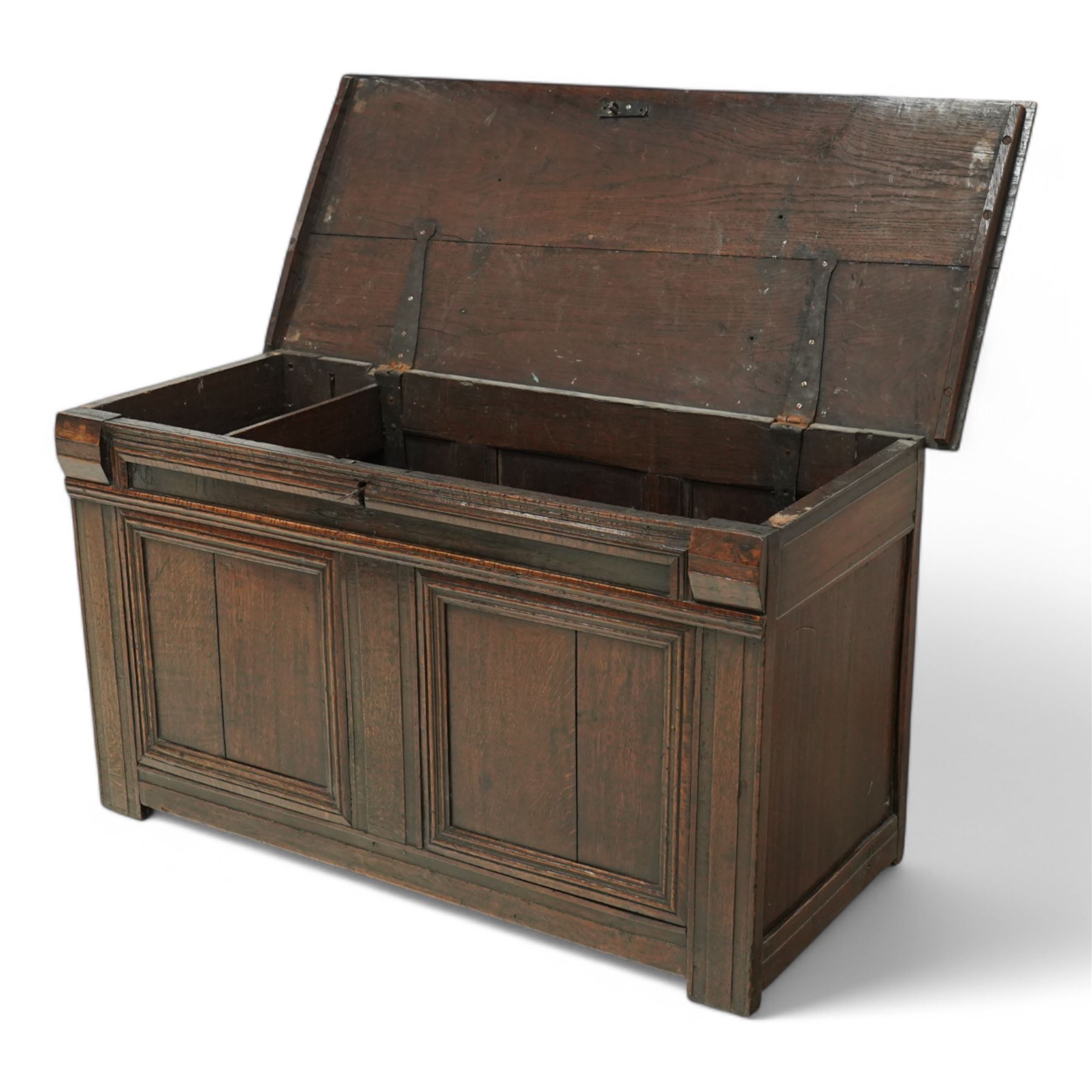 18th century oak blanket chest, chamfered rectangular hinged top over panelled front and sides, decorated with applied mouldings, on stile supports