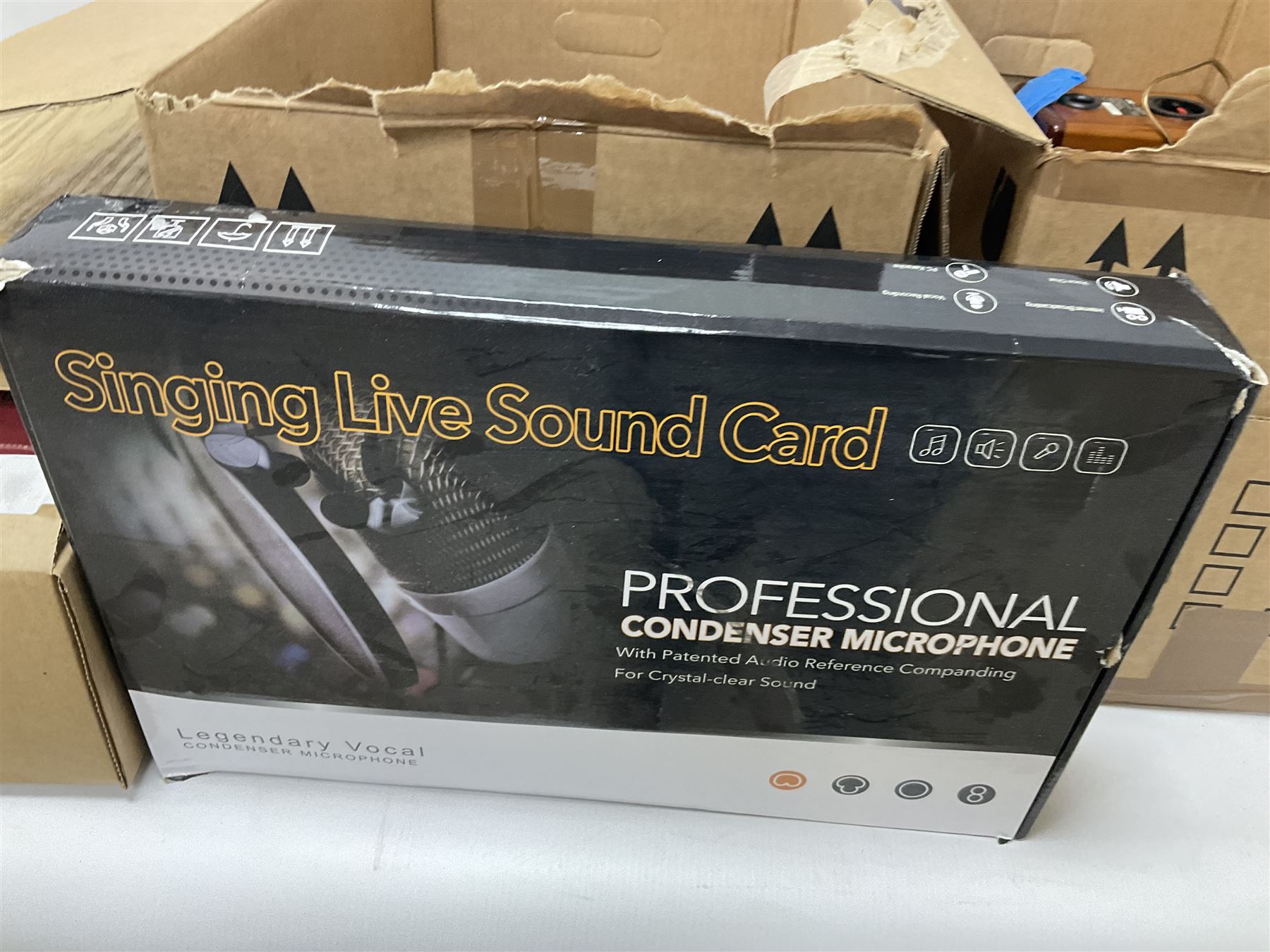 Condenser microphone, together with CD player, carved chess set, wooden figures etc in three boxes  