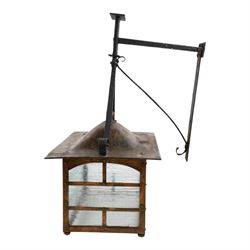 20th century, Arts and Crafts style copper porch lantern, of rectangular form, with cast iron scrolling wall fittings