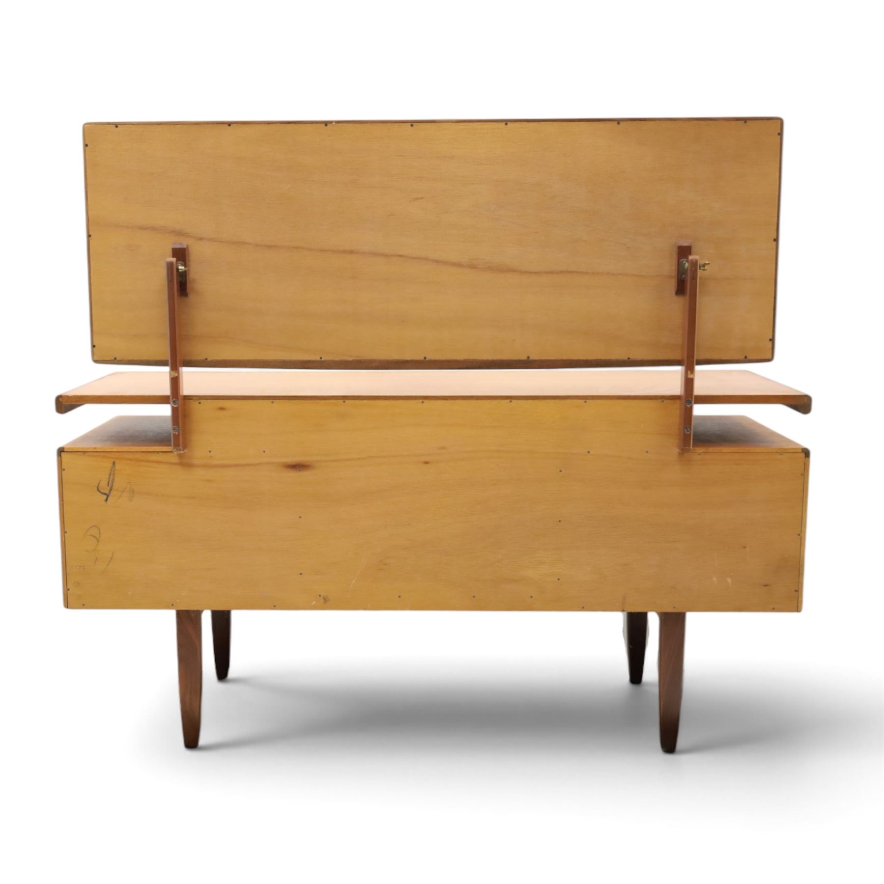 G-Plan - ‘Fresco’ teak dressing table, rectangular top with raised rectangular mirror, fitted with four drawers arranged as twin pedestals with sculpted handles, central knee-hole, on tapering supports