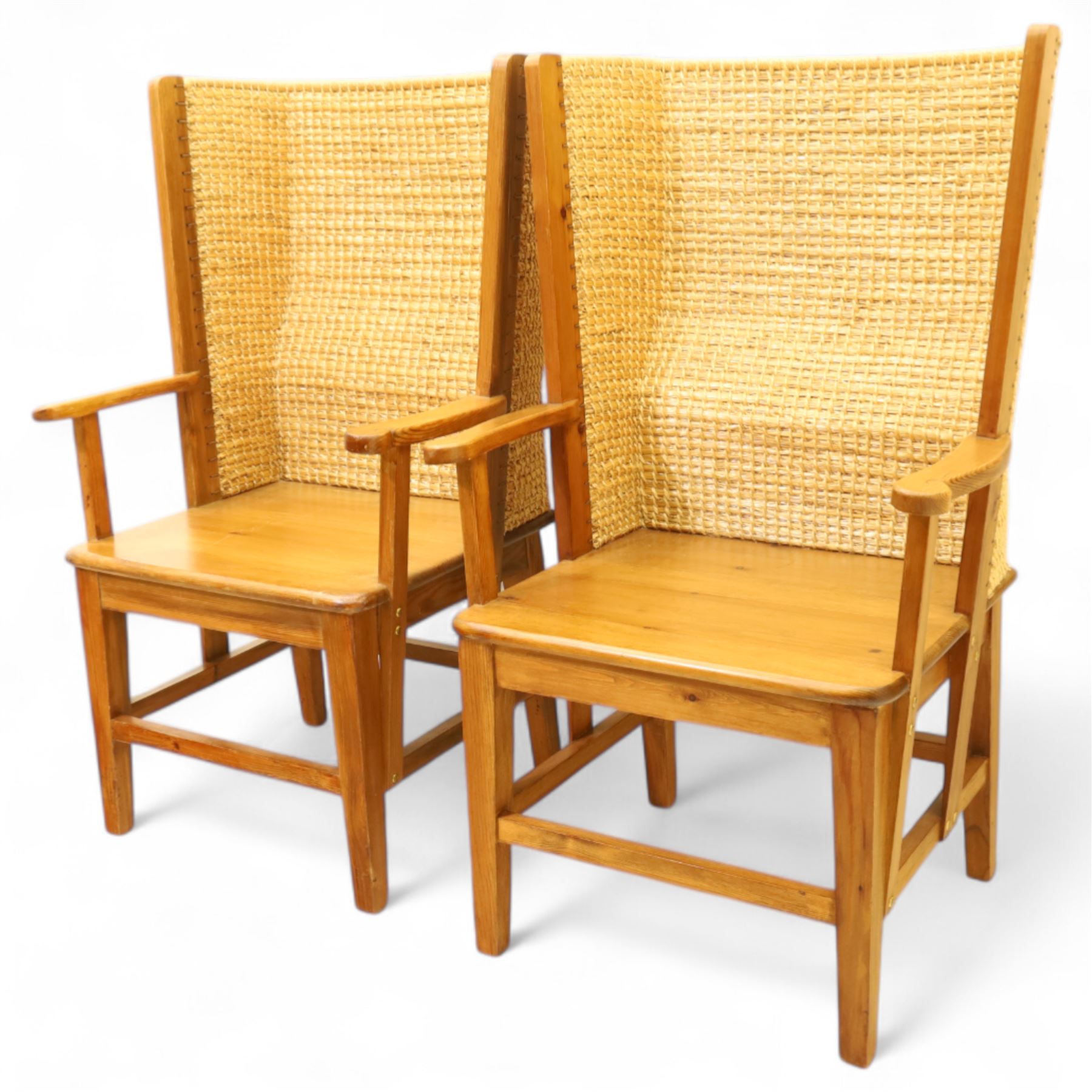 Pair of 20th century full-size pine Orkney chairs, high-back armchairs of traditional design, pegged and wedged construction, wrap-around backrest and sides, above scrolled out-swept arms and solid rounded pine seat, raised on square tapering legs united by stretchers, hand-signed ‘Jackie Miller’ and stamped ‘Orkney’
