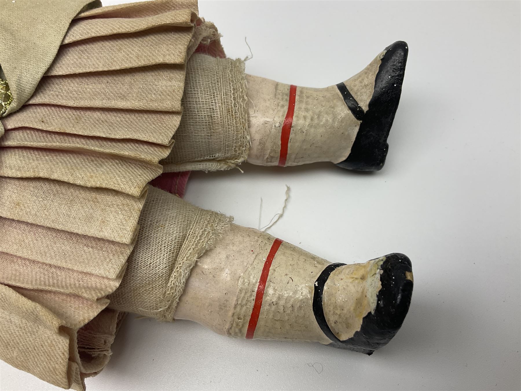 Victorian wax shoulder head doll with applied hair, inset glass eyes and jointed body with composition lower limbs; faded pink dress H35cm