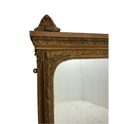19th century gilt wood and gesso framed overmantel mirror, the leaf moulded upper rail mounted by sitting putto within a laurel leaf wreath, foliate egg and dart moulded slip, plain mirror plate