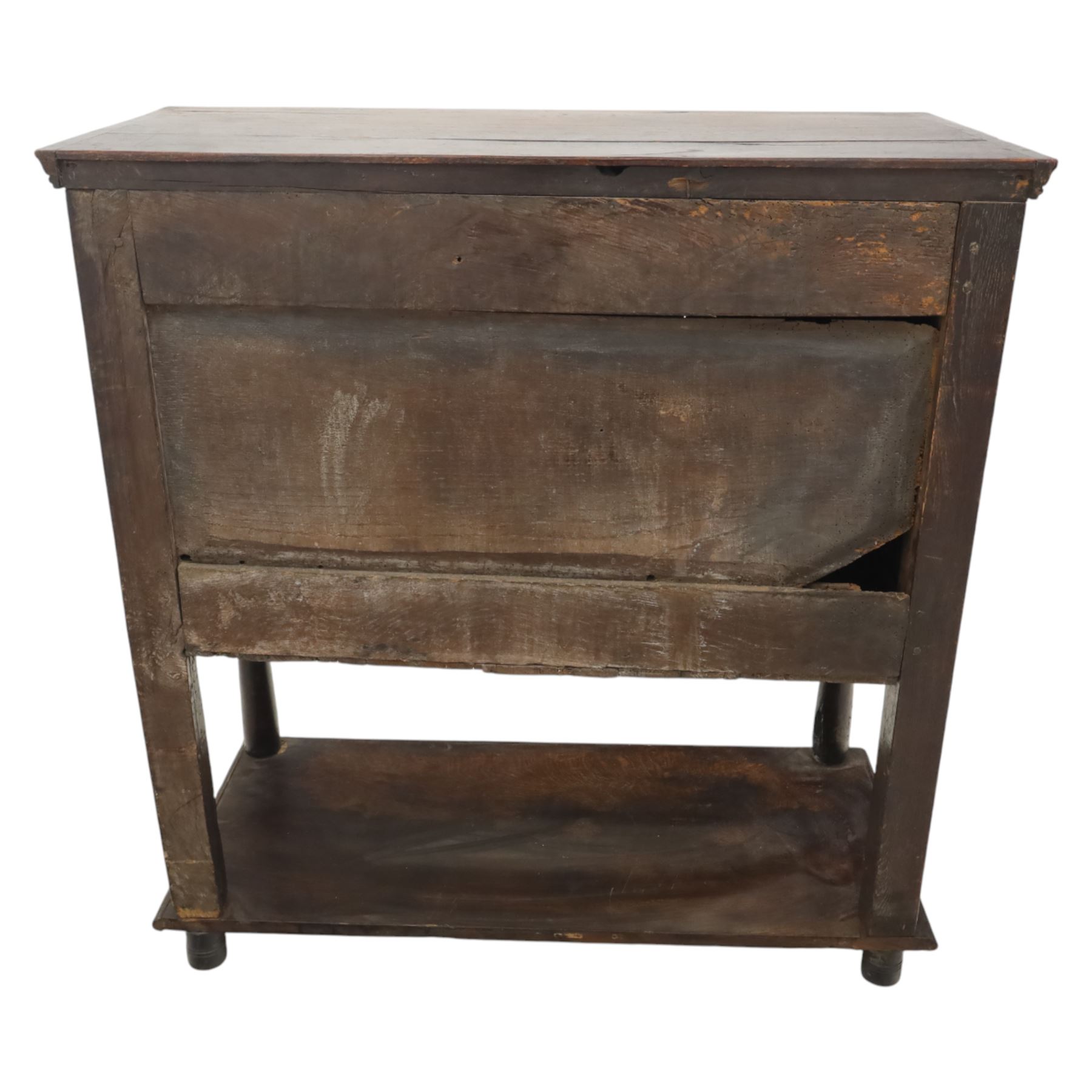 19th century oak cupboard cabinet, the moulded rectangular top above a deeply carved front carved with frieze of lunettes above a central panelled cupboard door with lozenge and foliate carving, flanked by vertical carved panels, upon turned legs with boarded lower shelf