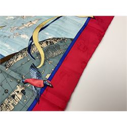 Hermès 'Christophe Colomb Découvre l'Amérique' jacquard silk scarf, designed by Carl de Parcevaux in 1992, limited edition for the bi-centenary of the discovery of America, printed with a central image of Christopher Columbus' ship at sea, surrounded with colourful stylised feathers, birds, flags, globes, shells and flowers, contained within vibrant red border, with rolled hand stitched edges and Hermes material label, 87cm square