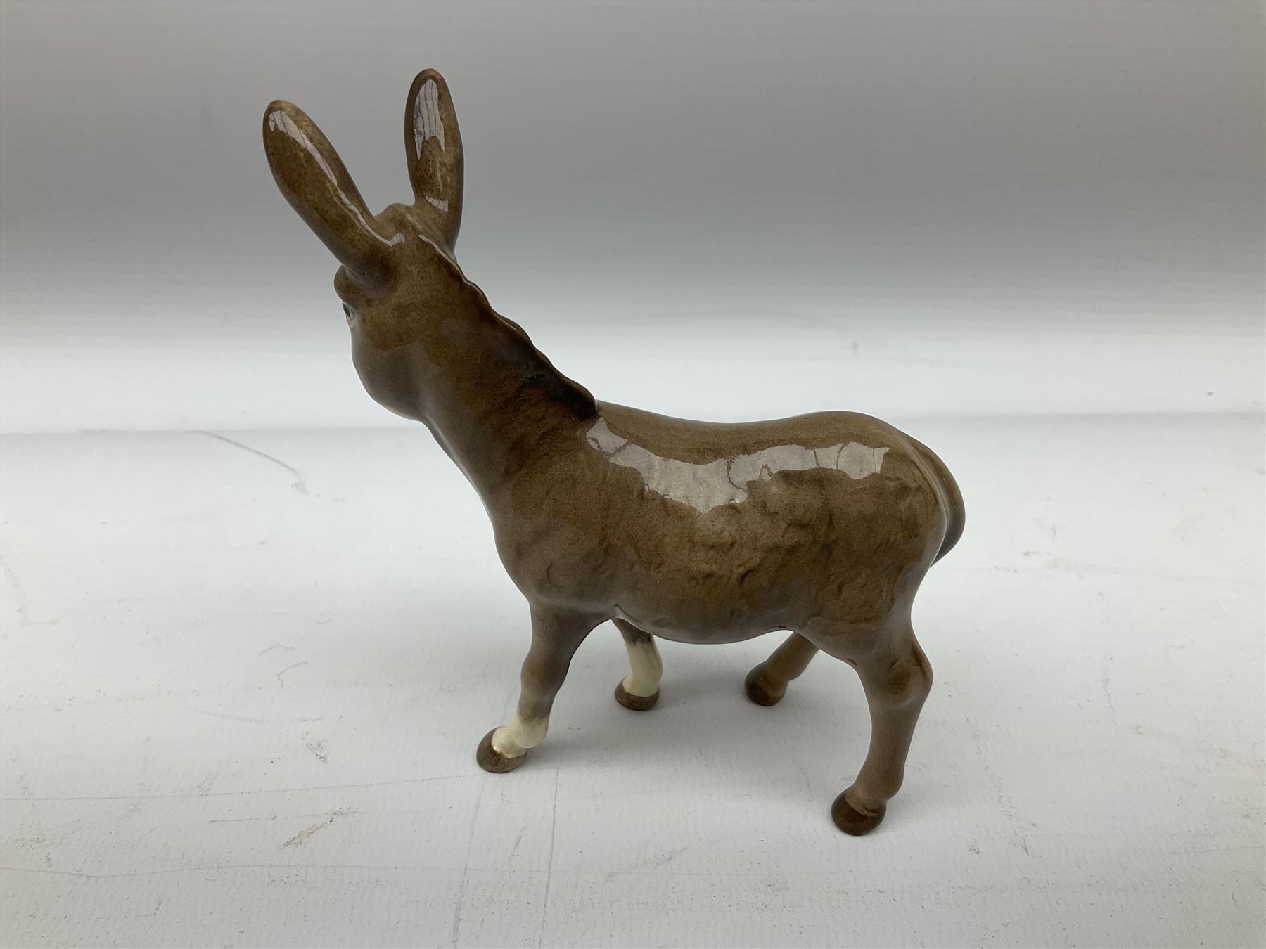 Beswick donkey family to include no.1364b, no.2267a, another donkey and donkey foal (4)