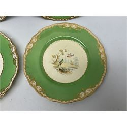 Set of four early 19th century plates, hand painted with birds within green and gilt ornate border D24cm