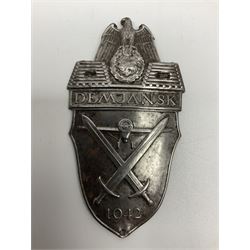 Two German Arm-Shield badges - one Russian Front marked Demjansk 1942; the other marked Narvik 1940 (2)