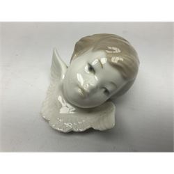 Three Lladro figures, comprising Dear Santa no 6166, Angelic Melody 1993 no 5963 and Seraphs Head no2 no 4885, together with Lladro plaque Love Brings Us Together no 7677, all with original boxes, largest example H18cm